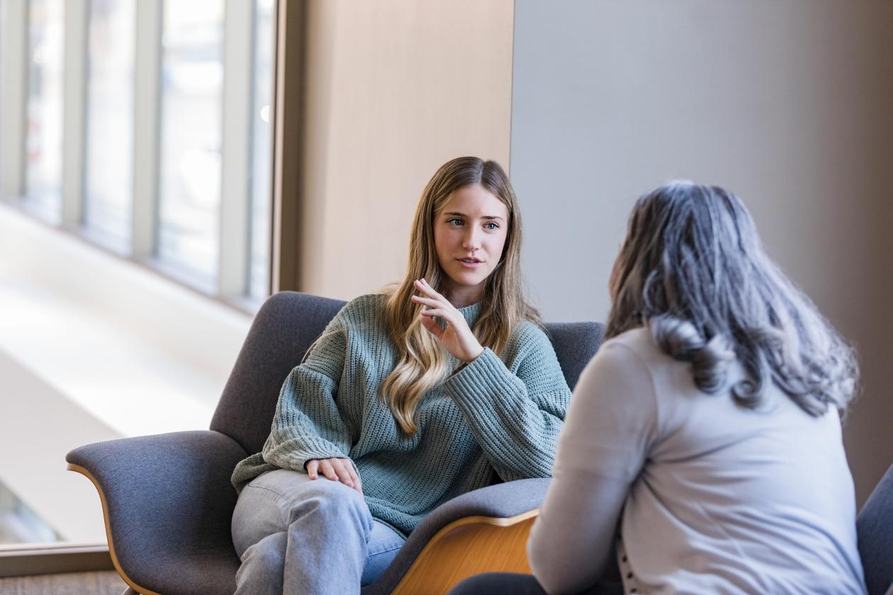 Two women sitting and talking