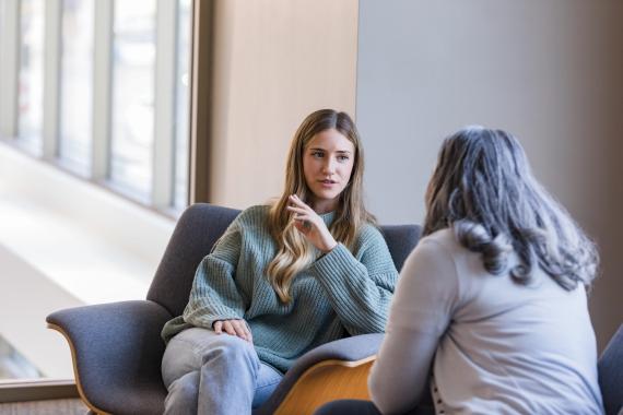 Two women sitting and talking